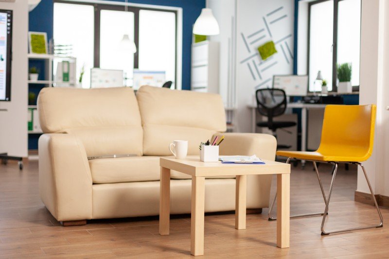 modern-business-relax-zone-interior-with-confortable-couch-orange-chair (1)